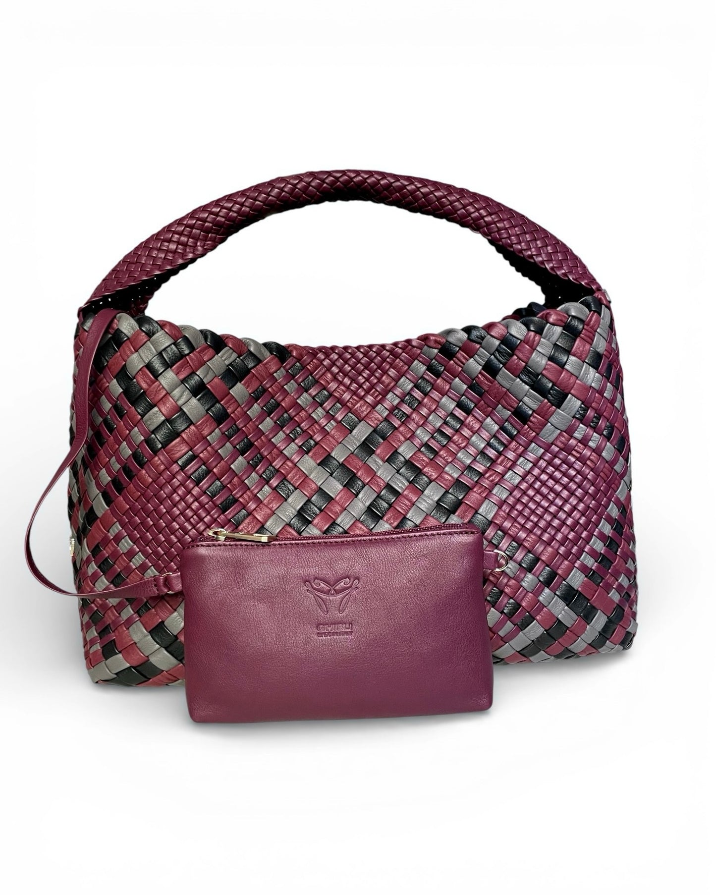 Purple woven handbag with a visible brand logo on a white background